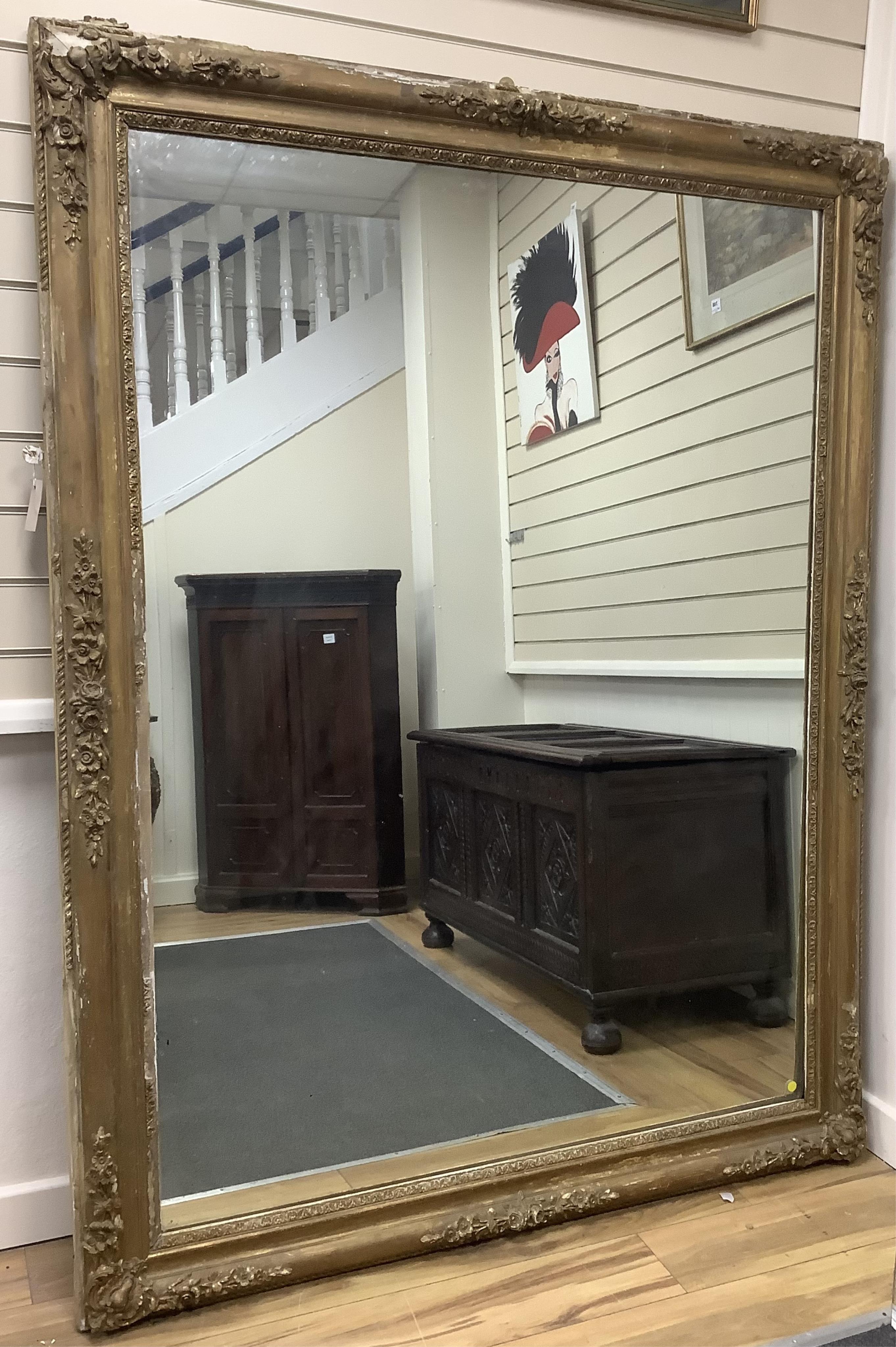 A large Victorian rectangular giltwood and composition overmantel mirror, width 137cm, height 178cm. Condition poor to fair